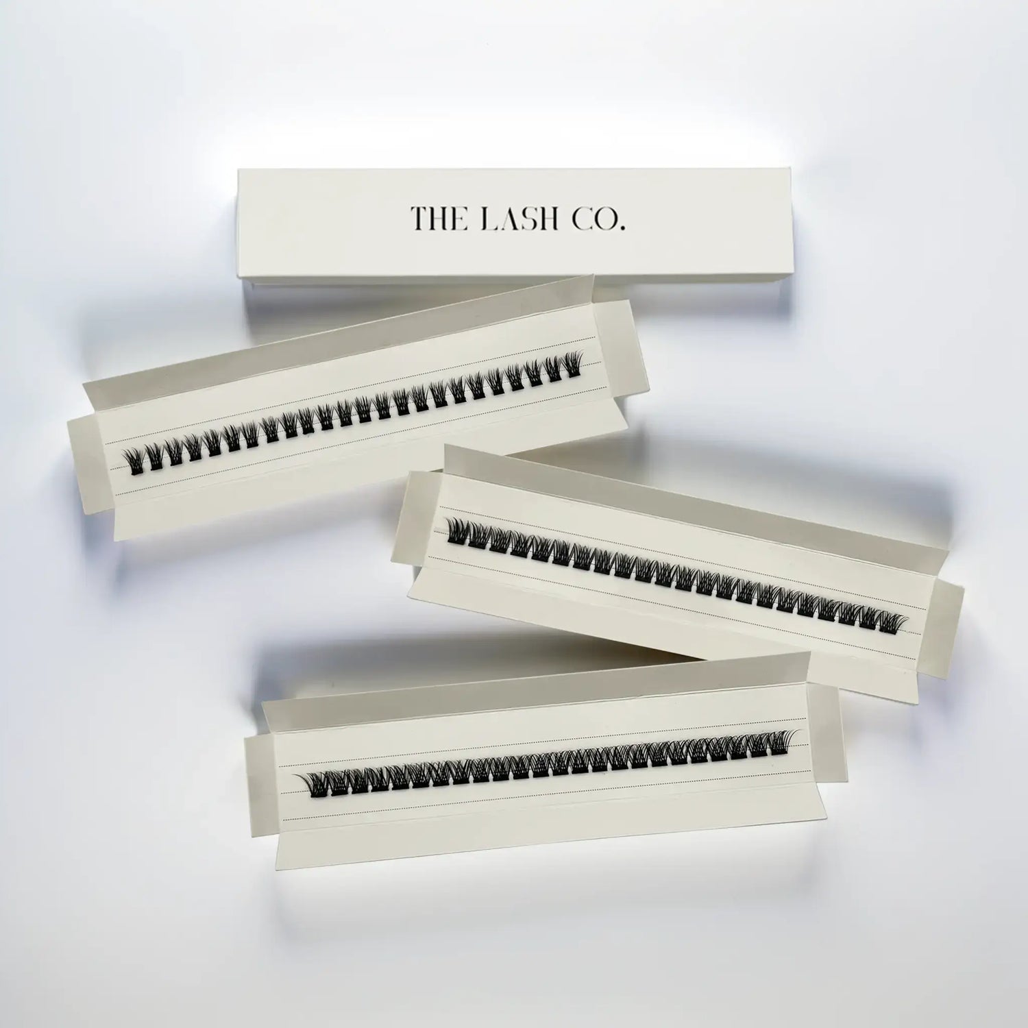 MinuteLashes Discovery Kit featuring three styles of cluster lashes in elegant packaging, offering dramatic and natural looks.