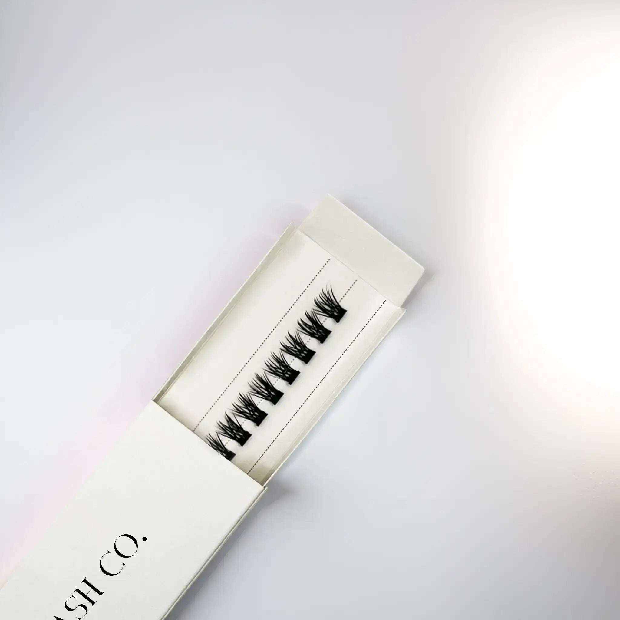 Nova Minute Lashes Cluster in box, offering elegant volume with reusable, self-adhesive false eyelashes for a dramatic look.